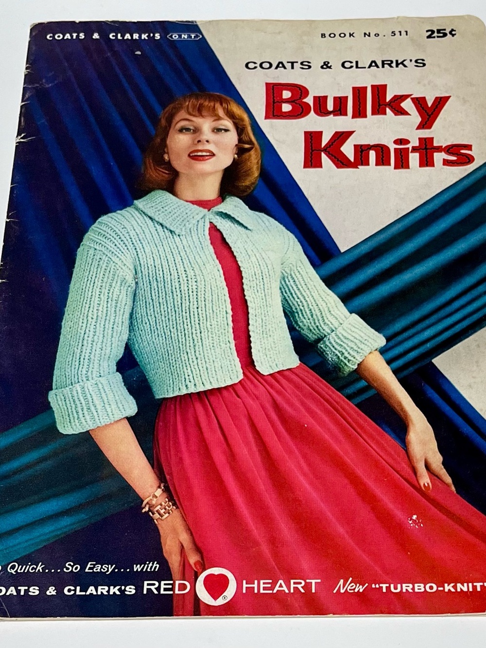 Vintage Pattern Book with Mint Green Cropped Knit Jacket with Pink Dress Accent
